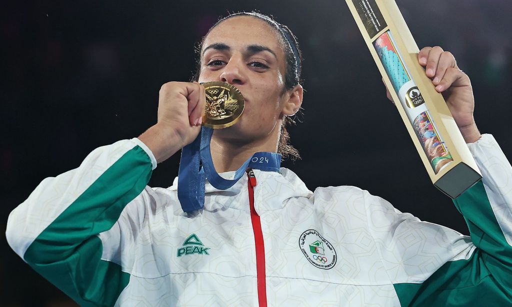 Imane Khelif holding an Olympic gold medal. 