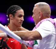 Imane Khelif of Team Algeria interacts with a coach of Team Algeria after Angela Carini of Team Italy (not pictured) abandons the Women's 66kg preliminary round match in the first round on day six of the Olympic Games Paris 2024 at North Paris Arena on 1 August, 2024 in Paris, France.