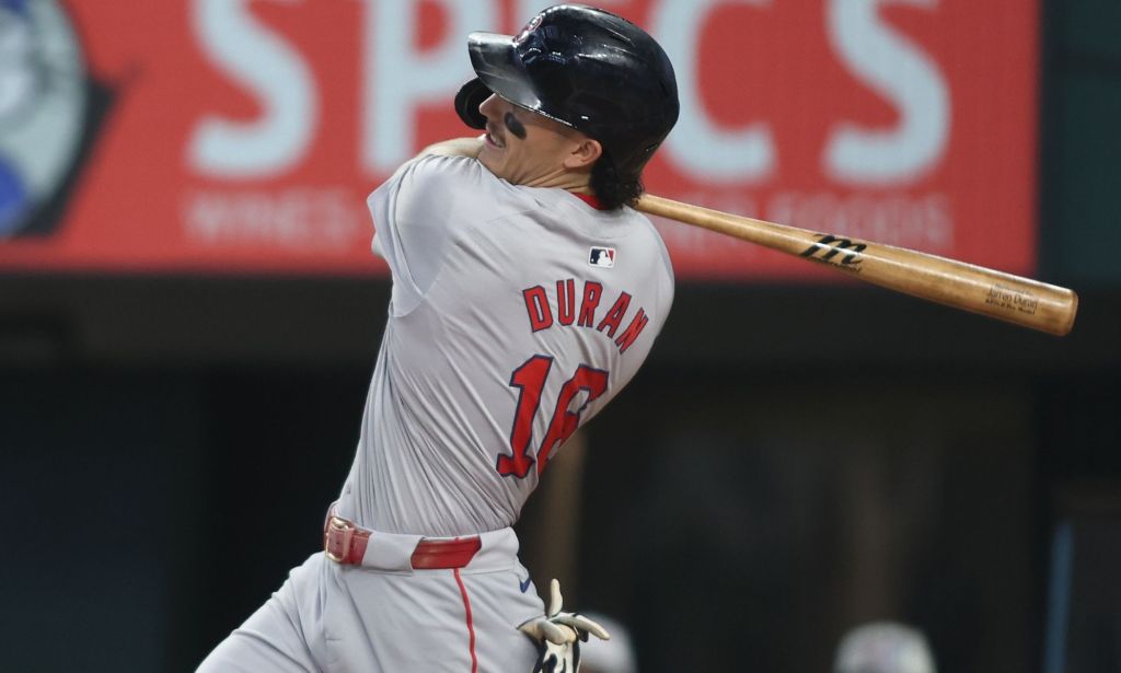 Jarren Duran swining a baseball bat.