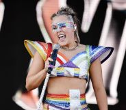 JoJo Siwa performs at a Pride event wearing rainbow-coloured outfit