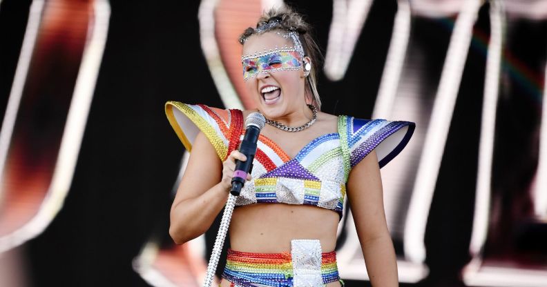 JoJo Siwa performs at a Pride event wearing rainbow-coloured outfit