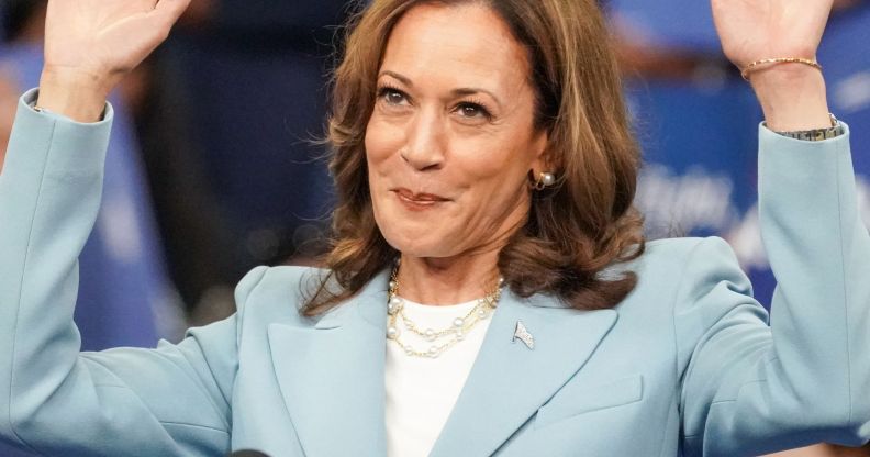 Kamala Harris raising her arms.