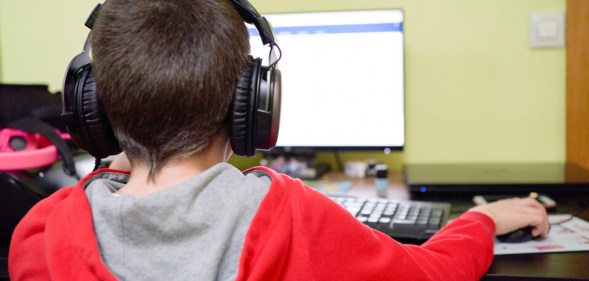 A child on a computer.