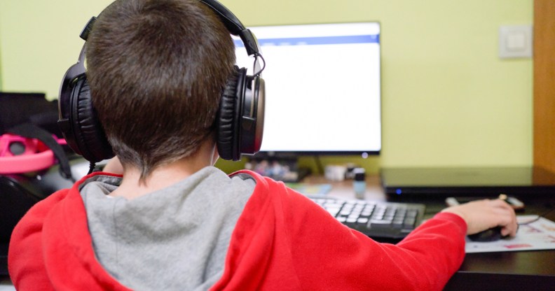 A child on a computer.