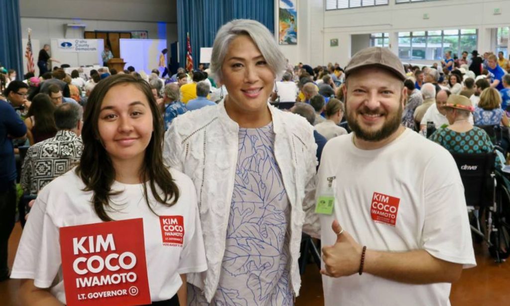 Kim Coco Iwamoto with two of her supporters. 