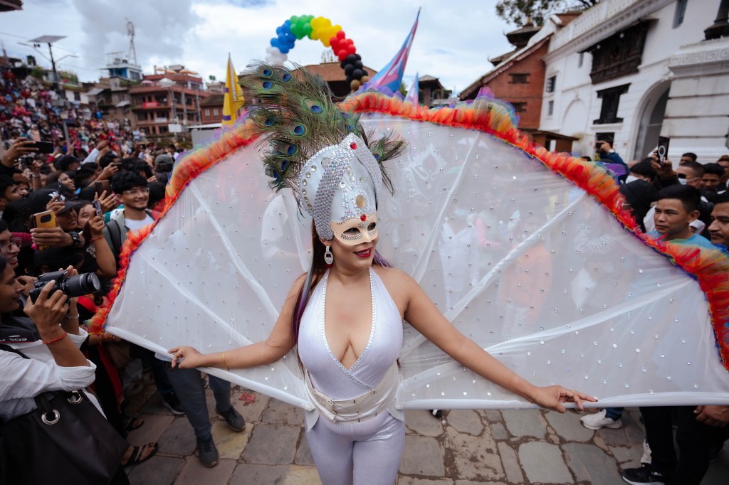 A participant in a fancy costume takes part in the Pride parade during the Gaijatra festival.  