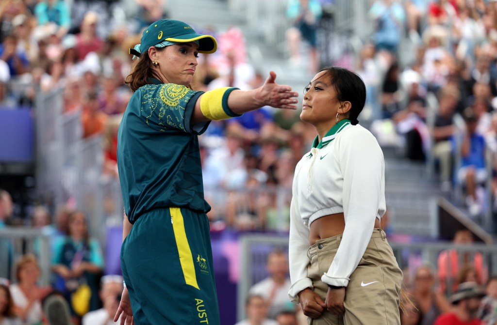 B-Girl Raygun of Team Australia and Logistx of Team United States react during the B-Girls Round Robin - Group B on day fourteen of the Olympic Games Paris 2024 at Place de la Concorde. 