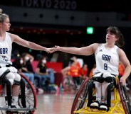 Britain's Robyn Love and her partner Laurie Williams touch hands in the wheelchair basketball women's classification playoff