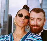 Sam Smith and Alicia Keys pose on a rooftop