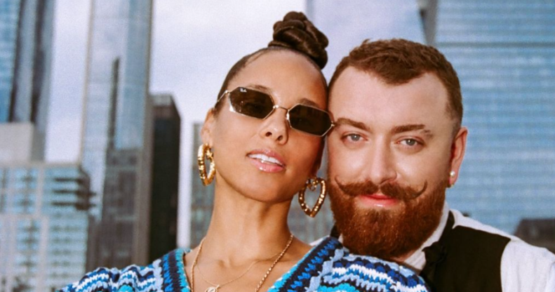 Sam Smith and Alicia Keys pose on a rooftop