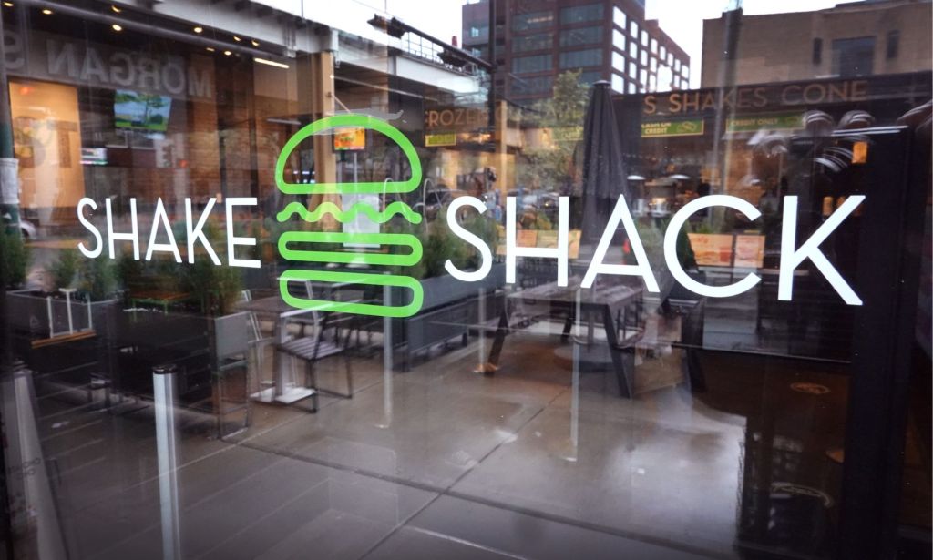 A window of a Shake Shack location.