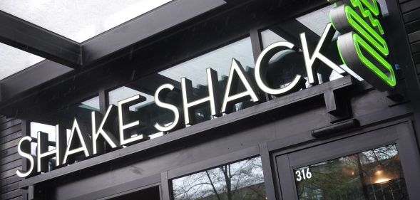 A sign outside of a Shake Shack.