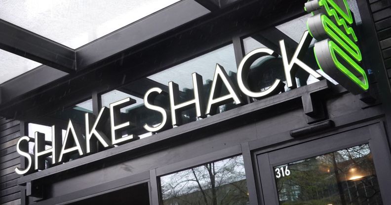 A sign outside of a Shake Shack.