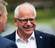 Minnesota Governor Tim Walz smiling while stood outside