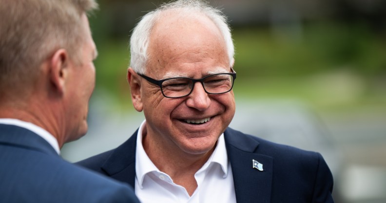 Minnesota Governor Tim Walz smiling while stood outside