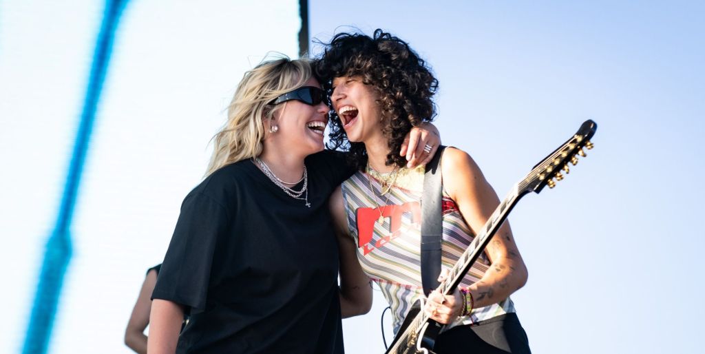 Towa Bird and Renee Rapp laugh as they perform at Coachella.