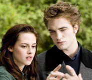 Bella and Edward in Twilight still, looking at their hands connecting