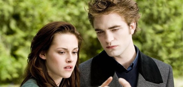 Bella and Edward in Twilight still, looking at their hands connecting