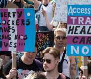 Protesters carry placards against the ban on puberty blockers and for accessible trans healthcare. (Wiktor Szymanowicz/Future Publishing via Getty Images)