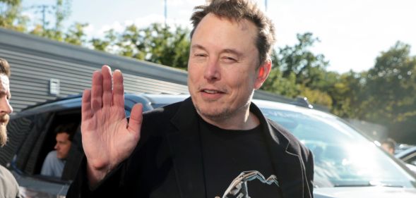 Elon Musk waving to the camera