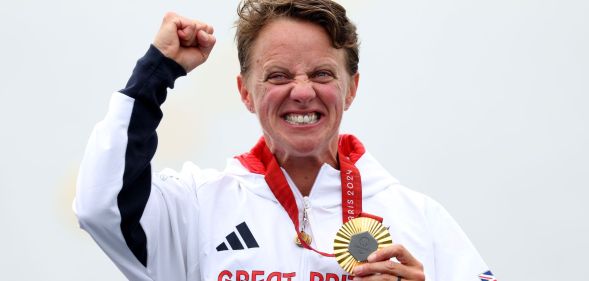 Gold medalist Emma Wiggs of Team GB celebrates on the podium at the Paris Paralympic Games 2024