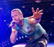 Chris Martin of Coldplay performs as the band headline the Pyramid stage during day four of Glastonbury Festival