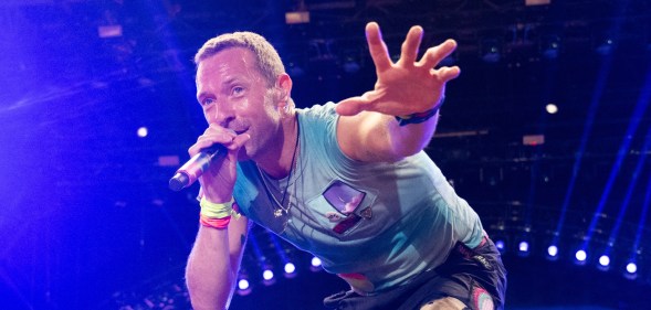 Chris Martin of Coldplay performs as the band headline the Pyramid stage during day four of Glastonbury Festival