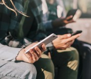 Young people using their mobile phones.