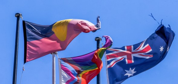 Australian Aboriginal flag, Pride flag, and Australian flag.