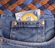 Condom in jeans pocket close up