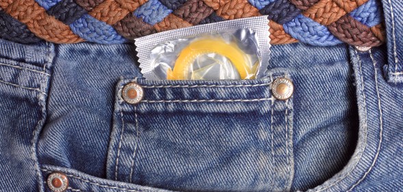 Condom in jeans pocket close up