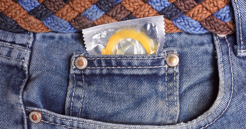 Condom in jeans pocket close up