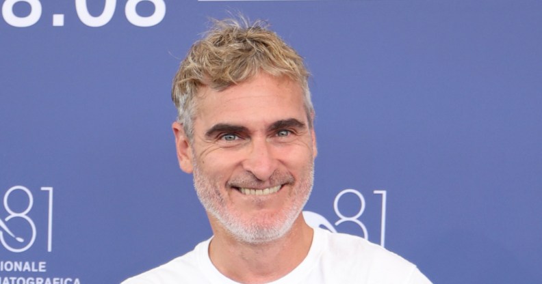 Joaquin Phoenix smiling during the press shoot at Venice Film Festival