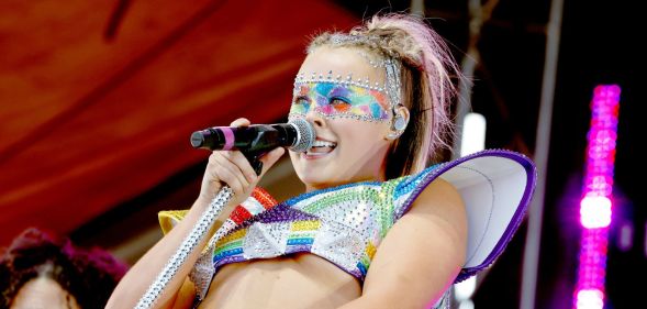 Jojo Siwa performs in a rainbow outfit at a Pride event