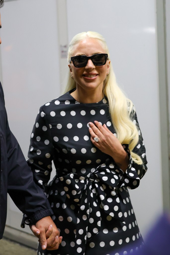 Lady Gaga is seen arriving at the 81st Venice Film Festival in a polka dot dress showing off her engagement ring