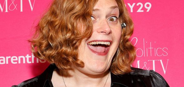 Lily Wachowski smiling at a red carpet event.