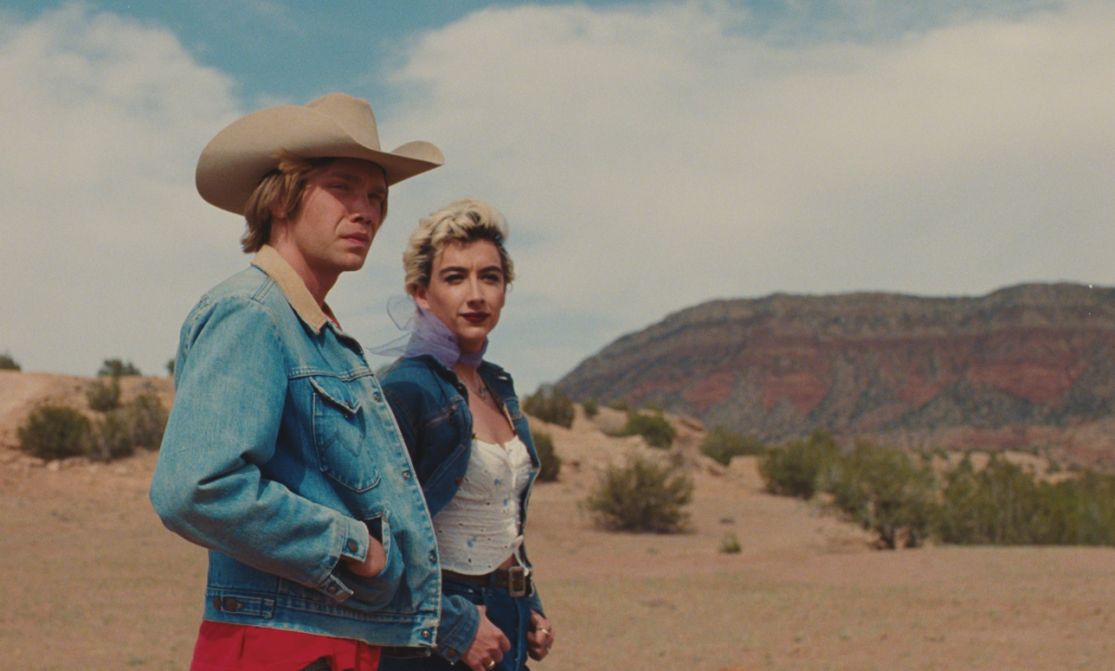 National Anthem still: Charlie Plummer and Mason Alexander Park in denim jackets walking around the ranch