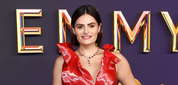 Nava Mau in a red gigi goode dress at the emmy awards red carpet