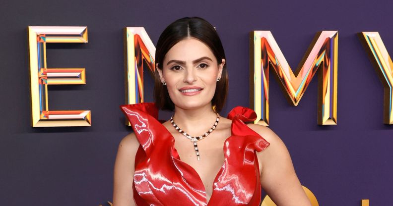 Nava Mau in a red gigi goode dress at the emmy awards red carpet