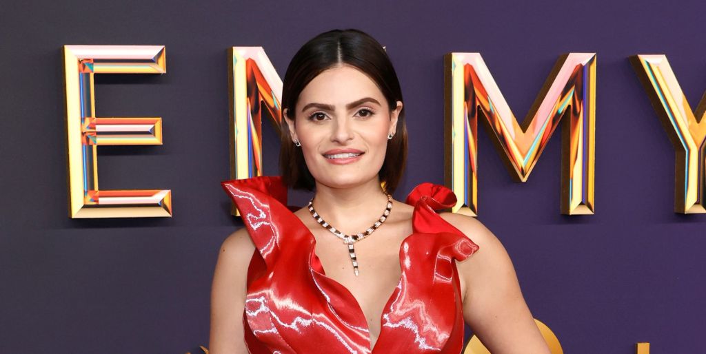 Nava Mau in a red gigi goode dress at the emmy awards red carpet