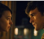 Daisy Edgar-Jones and Jacob Elordi staring intently at eachother in a still of On Swift Horses