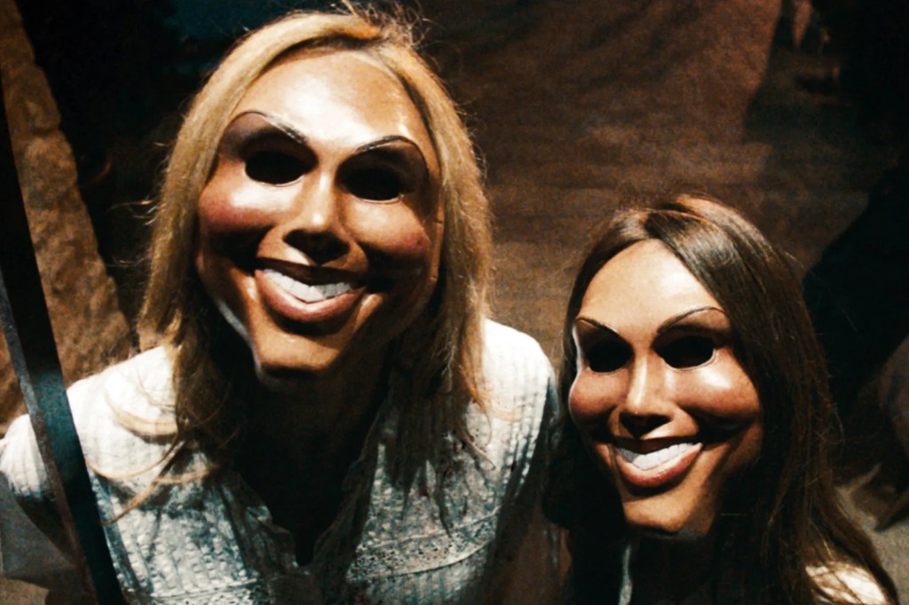 The purge still; two masked people holding a knife