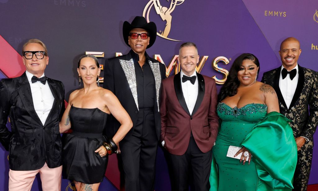 Several members of the RuPaul's Drag Race team on the red carpet.