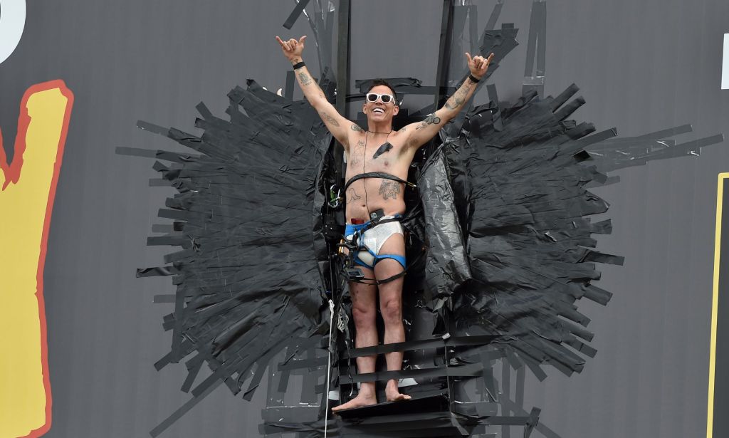 Steve-O after duct-taping himself to a billboard.