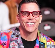 Steve-O smiling while seated in a venue.