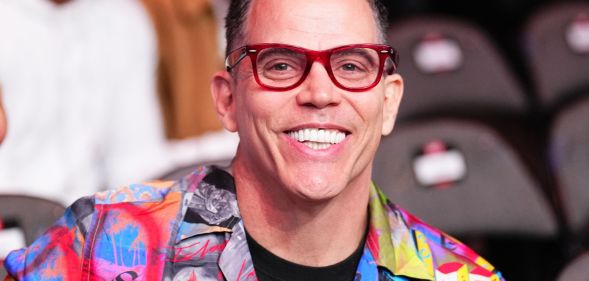 Steve-O smiling while seated in a venue.