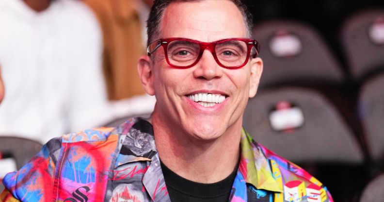 Steve-O smiling while seated in a venue.