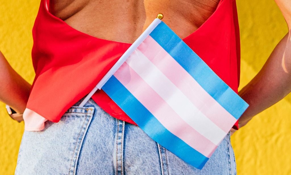 A trans flag in a person's pocket.