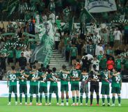 Players of Al Ahli stand in front of their fans prior to the King's Cup match between Al Ahli and Al Jndal at Prince Abduallah Al Faisal Stadium on September 23, 2024 in Jeddah, Saudi Arabia