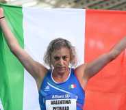 Trans Paralympian Valentina Petrillo holding an Italian flag